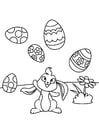 Conejito de pascua juega con huevos de pascua