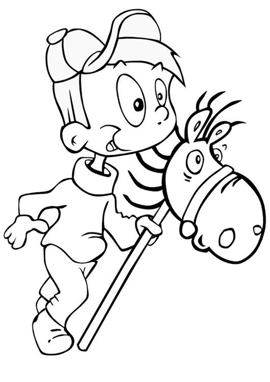 Niño con caballito de palo