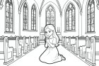 Una niña reza en la iglesia.