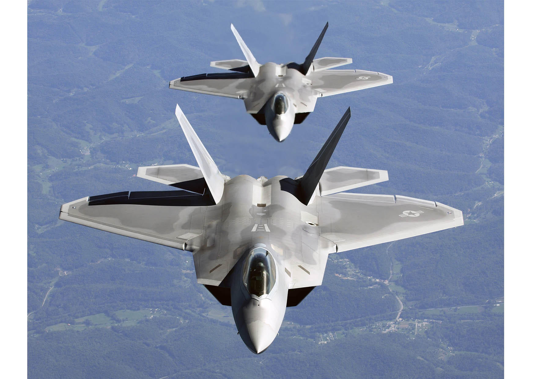 f-22 a raptor en formaciA³n Foto f-22 a raptor en formaciA³n